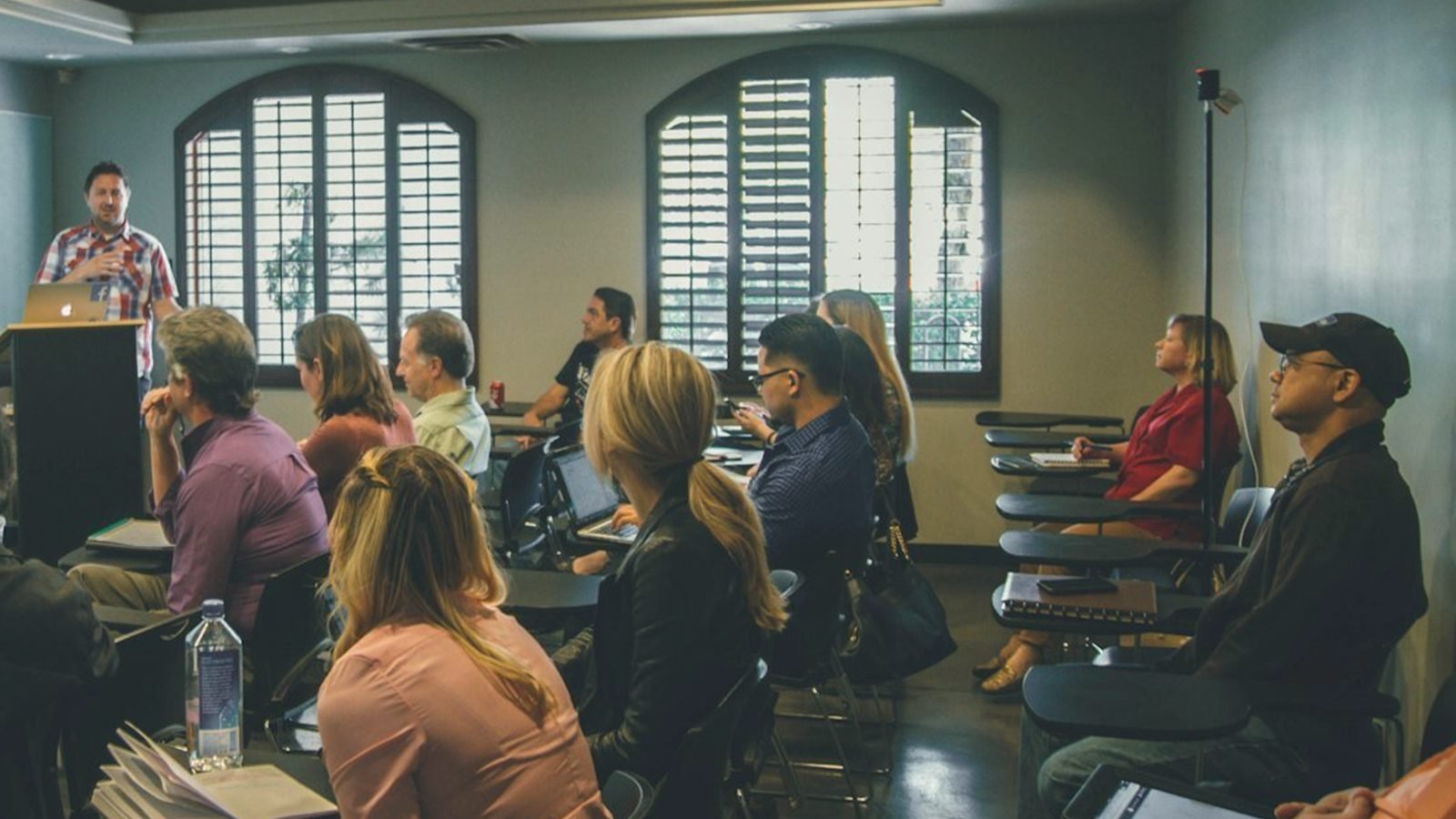 A team following a hands-on AI training workshop in a meeting room